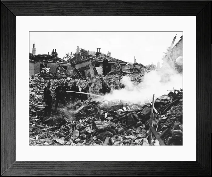 Framed Print : Firemen damp down a fire at a Southampton building after WW2 air raid. 1943 Framed Print : Firemen damp down a fire at a Southampton building after WW2 air raid. 1943