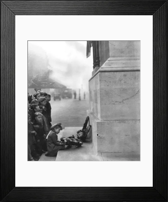 Framed Print : Children celebrate the end of WW2 in Europe VE Day be laying wreath at the Cenotaph in