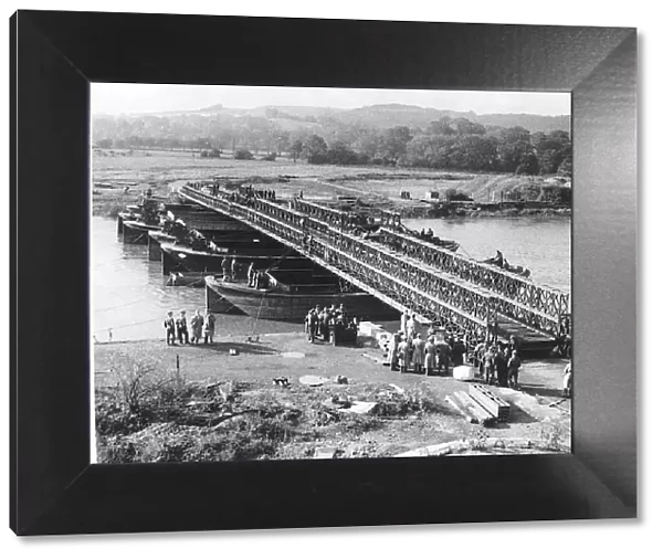 Newly invented Bailey Bridge built in Britain and the USA is demonstrated across a