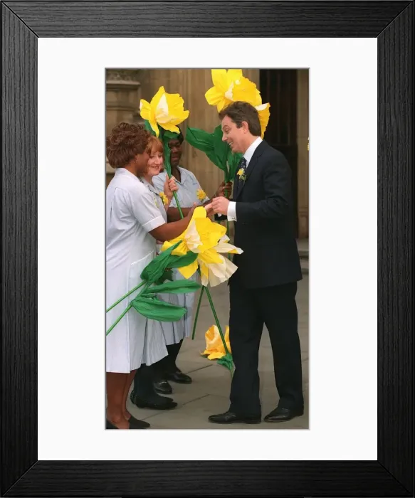 Framed Print : Tony Blair at the launch of 1997 Marie Curie Cancer Care Daffodil Campaign at the House