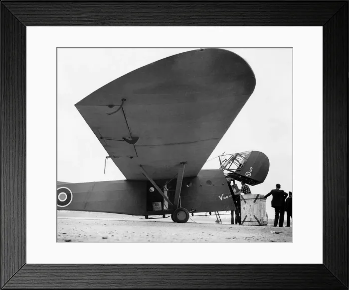Framed Print : A Canadian Air Force CG4a supply glider is loaded before being towed across