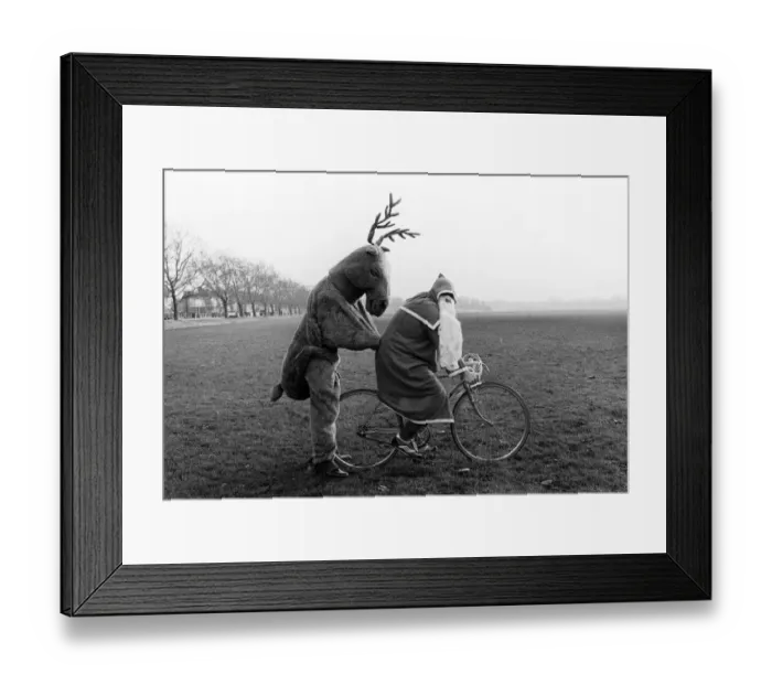 : Father Christmas and Rudolf the Reindeer - bike stunt A©Mirrorpix circa 1980 : Father Christmas and Rudolf the Reindeer - bike stunt A©Mirrorpix circa 1980