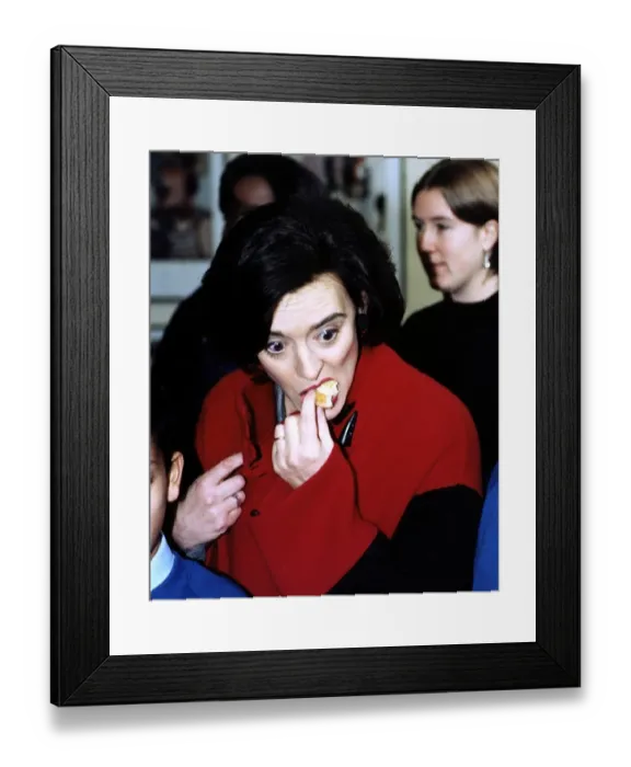 Framed Print : Cherie Blair wife of Labour MP Tony Blair seen eating a cake at a school in Fulham in aid