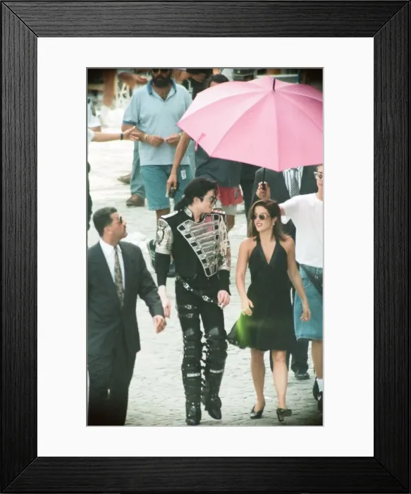 Framed Print : American pop singer Michael jackson with his new bride Lisa-Marie Presley walking