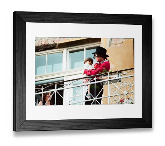 Framed Print : American pop singer Michael Jackson with young orphan Bela Farkas posing on a hotel Framed Print : American pop singer Michael Jackson with young orphan Bela Farkas posing on a hotel