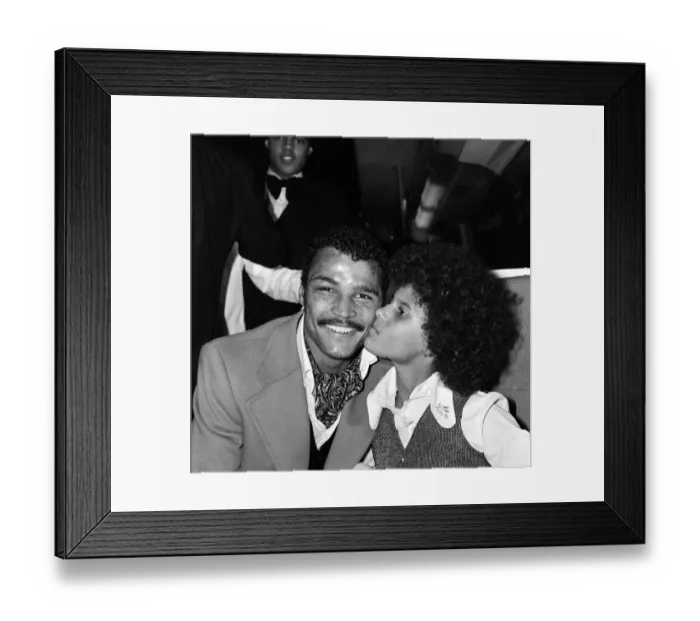 Framed Print : John Conteh celebrates with family aboard a playboy motor coach after winning world title