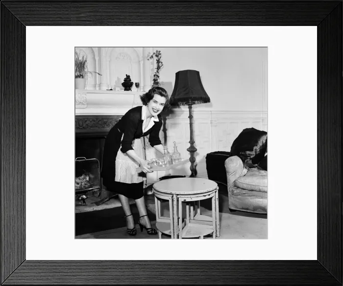 Framed Print : Avis Scott, about to start as a BBC TV Announcer, dressed as a maid which was her Framed Print : Avis Scott, about to start as a BBC TV Announcer, dressed as a maid which was her