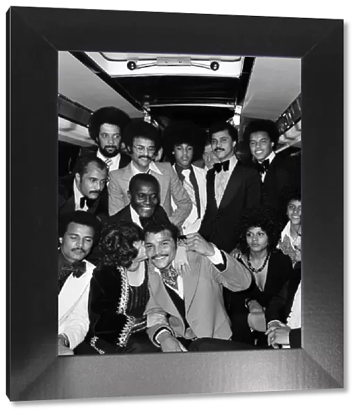 John Conteh celebrates with family aboard a playboy motor coach after winning world title