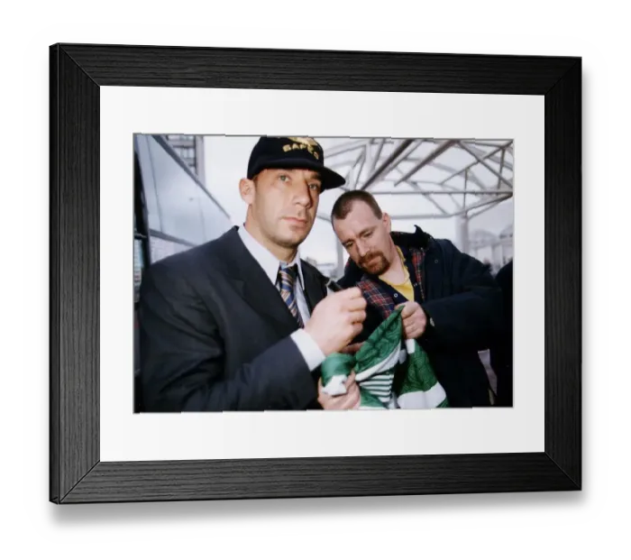 Framed Print : Juventus and Italy footballer Gianluca Vialli wearing a grey baseball cap and striped tie