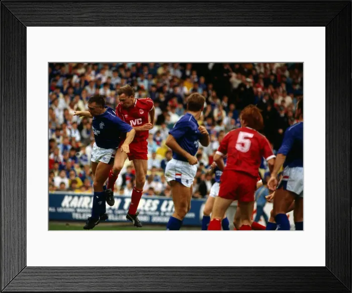 Framed Print : Aberdeen versus Rangers Premier Davie Dodds heads ball past Graham Roberts August 1987 Framed Print : Aberdeen versus Rangers Premier Davie Dodds heads ball past Graham Roberts August 1987