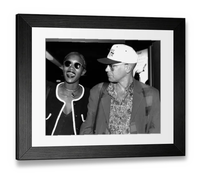 Framed Print : Naomi Campbell and fiance Adam Clayton from band U. 2 arriving at Heathrow from Madrid