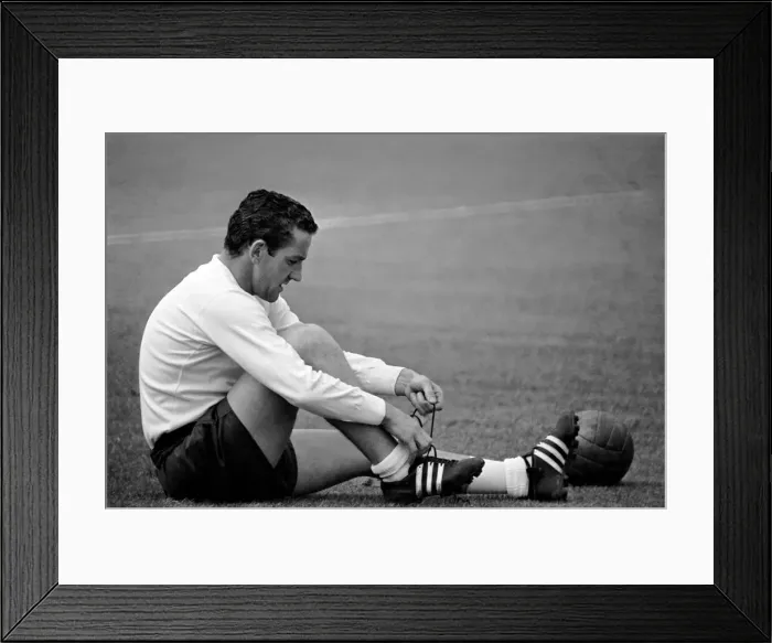 Framed Print : Tottenham Hotspur player Dave Mackay ties up his boot laces during a pre-season training Framed Print : Tottenham Hotspur player Dave Mackay ties up his boot laces during a pre-season training