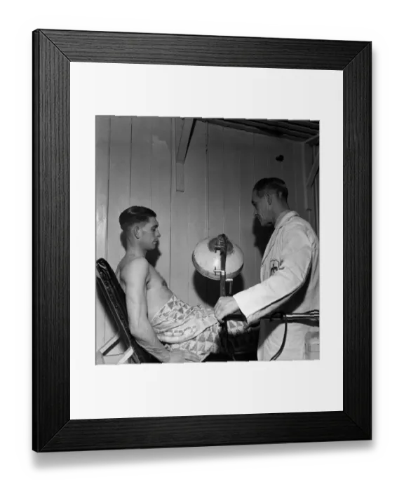 Framed Print : Fulham F. C. Trainer F Penn treats Jimmy Taylor for injury. March 1949 O17597 Framed Print : Fulham F. C. Trainer F Penn treats Jimmy Taylor for injury. March 1949 O17597