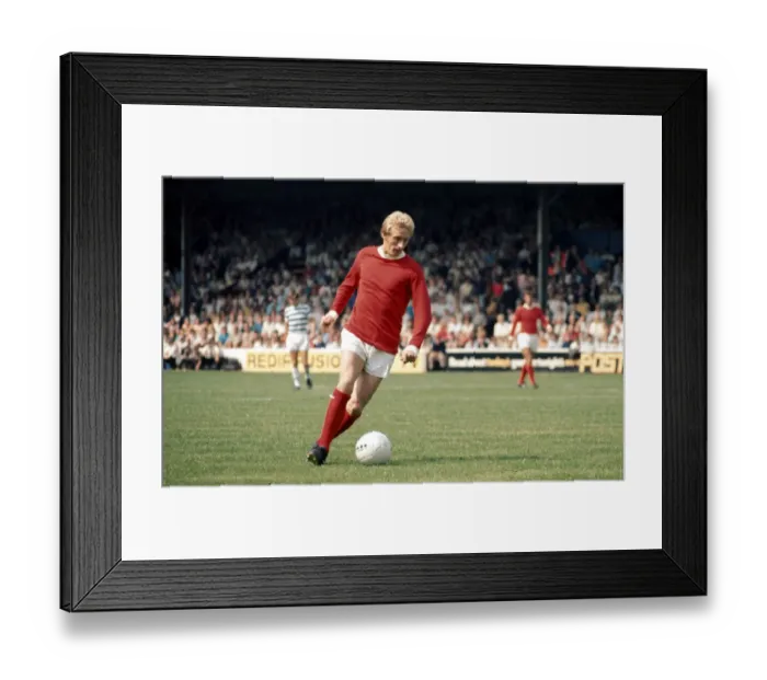 Framed Print : Denis Law in action for Manchester United during their English League Division One match