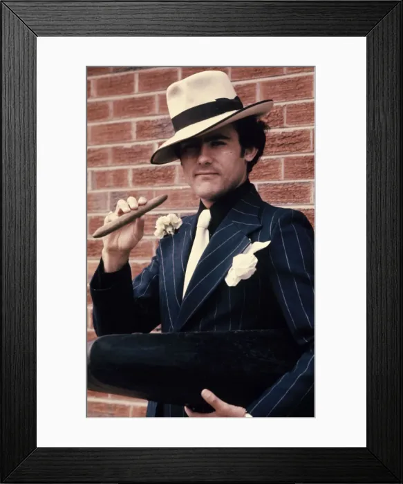 Framed Print : Liverpool star Ray Kennedy smoking a cigar dressed as Chicago gangster Al Capone Framed Print : Liverpool star Ray Kennedy smoking a cigar dressed as Chicago gangster Al Capone