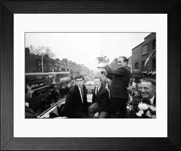 Framed Print : Tottenham Hotspur team hold the FA Cup trophy aloft from an open top double decker bus to