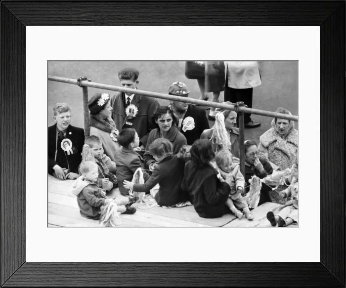 Framed Print : Tottenham Hotspur fans wait for their team to arrive home after defeating Burnley 3-1 in