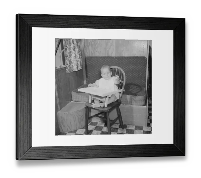 Framed Print : Baby in high chair Circa 1959