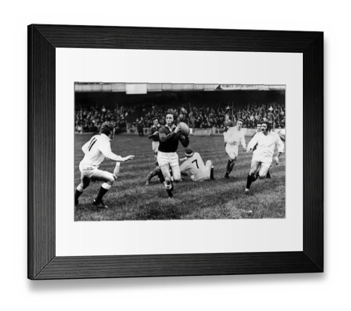 Framed Print : A fine study of full back JPR Williams as he breaks away for Probables in the Welsh