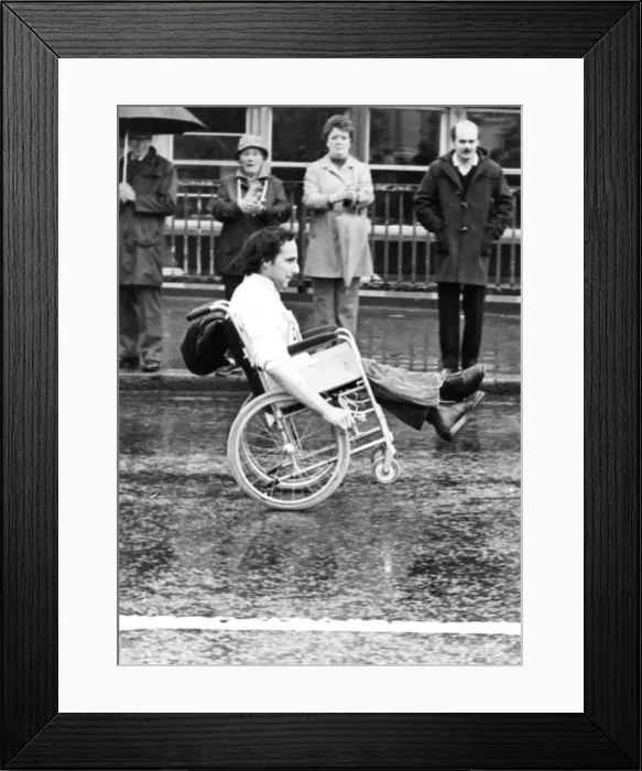 Framed Print : The Great North Run 27 June 1982 - A wheelchair competitor does a wheelie across the Tyne