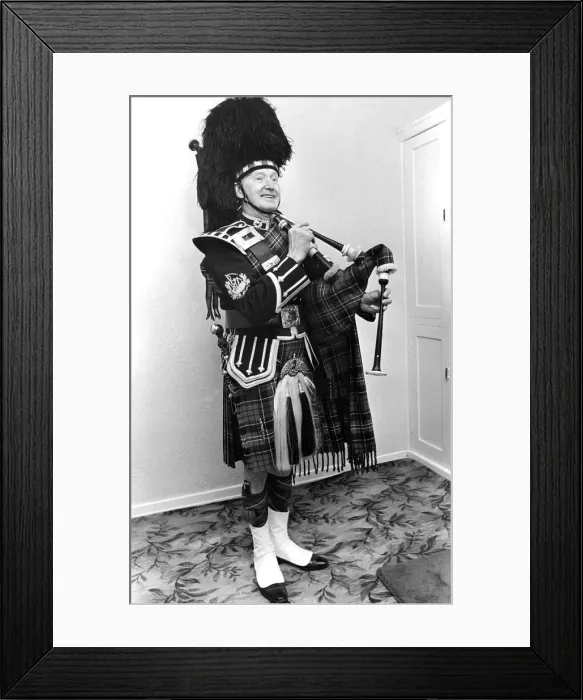 Framed Print : A piper smarly dressed in his uniforn and ready to play the bagpipes in March 1982