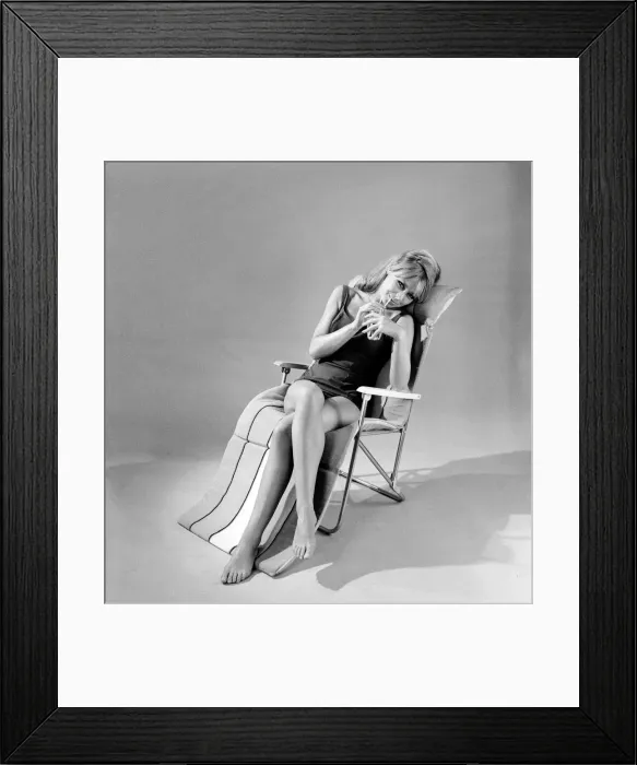 Framed Print : Beach furniture feature, model in swimsuit. Circa 1964 Framed Print : Beach furniture feature, model in swimsuit. Circa 1964