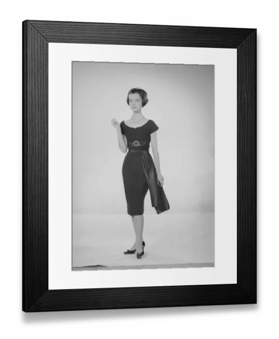 Framed Print : Model Jennifer Goddard. Young woman in short dressy black dress