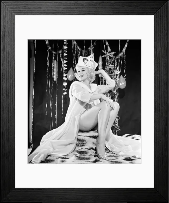 Framed Print : Woman modelling party clothes for Christmas / New Year photo shoot. Circa 1964 Framed Print : Woman modelling party clothes for Christmas / New Year photo shoot. Circa 1964