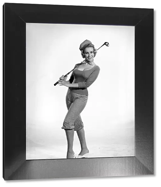 Woman golfer, model Rita Royce. 1960 E389