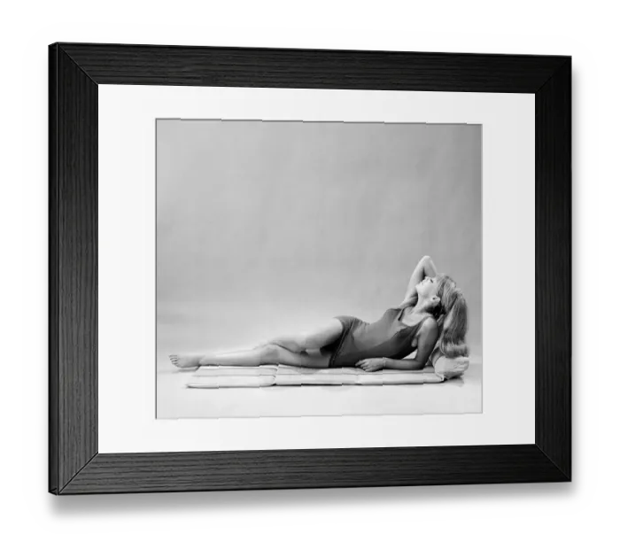 Framed Print : Beach furniture feature, model in swimsuit. Circa 1964 Framed Print : Beach furniture feature, model in swimsuit. Circa 1964