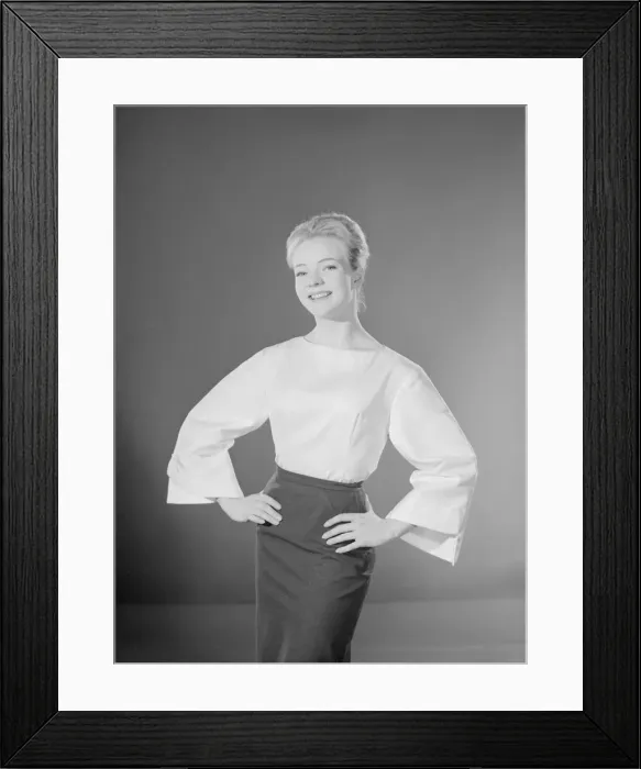 Framed Print : Model Valerie Hollman wearing white blouse and dark skirt