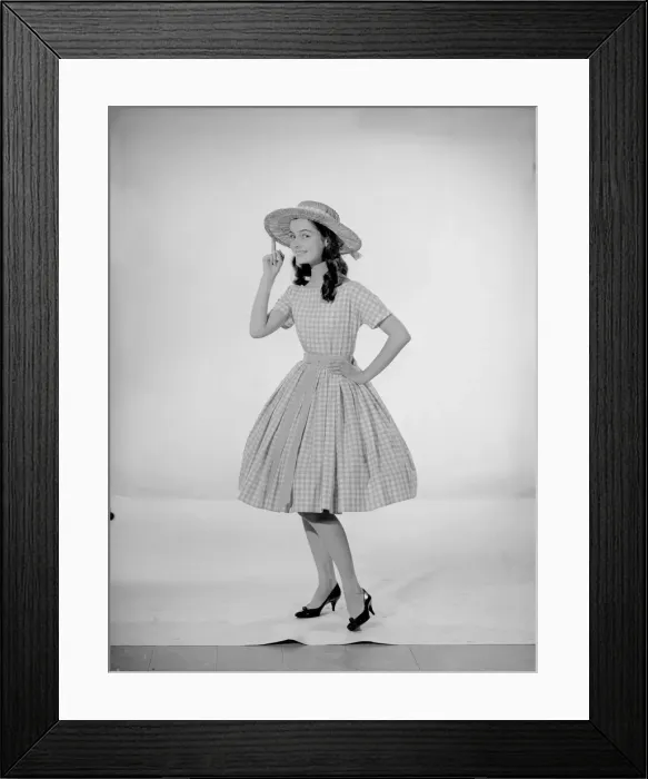 Framed Print : Model Jennifer Goddard. Brown-haired girl in checkered dress with hat Framed Print : Model Jennifer Goddard. Brown-haired girl in checkered dress with hat