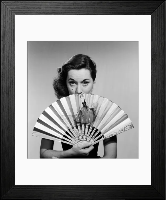 Framed Print : Model with fan in strapless dress. Circa 1964 Framed Print : Model with fan in strapless dress. Circa 1964