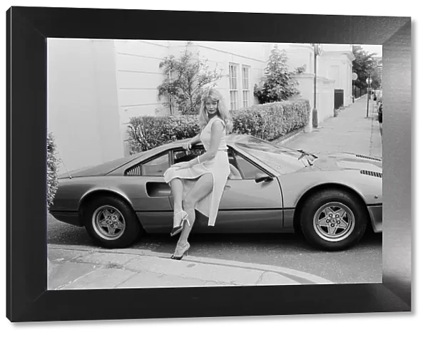 Glamour model Tina poses next to a Ferrari 308 GTB. 11th July 1979