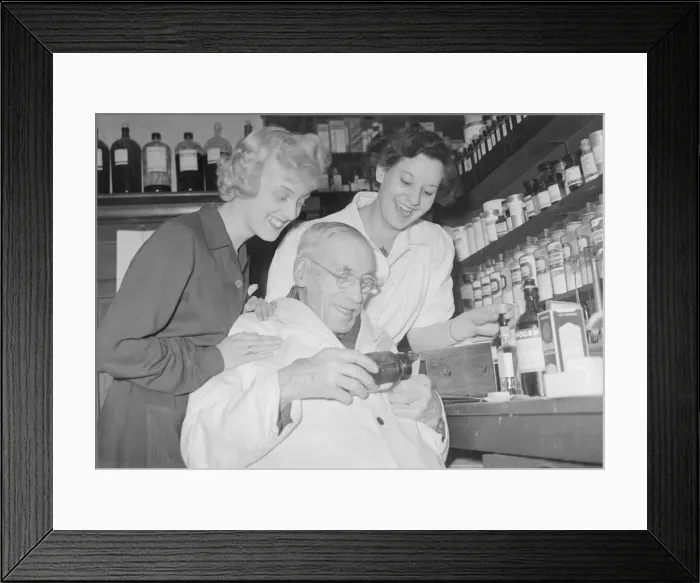 Framed Print : Mr Arthur Lawson 94 year old chemist seen here at work with his assistants at his Framed Print : Mr Arthur Lawson 94 year old chemist seen here at work with his assistants at his