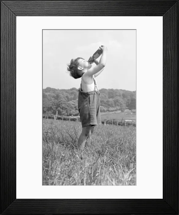 Framed Print : Johnnie Goodwillie seen here taking a drink of lemonade on a hot late spring day in May