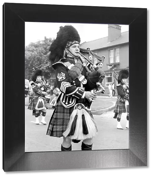 Pipers marching along and playing in July 1971. 12  /  07  /  71