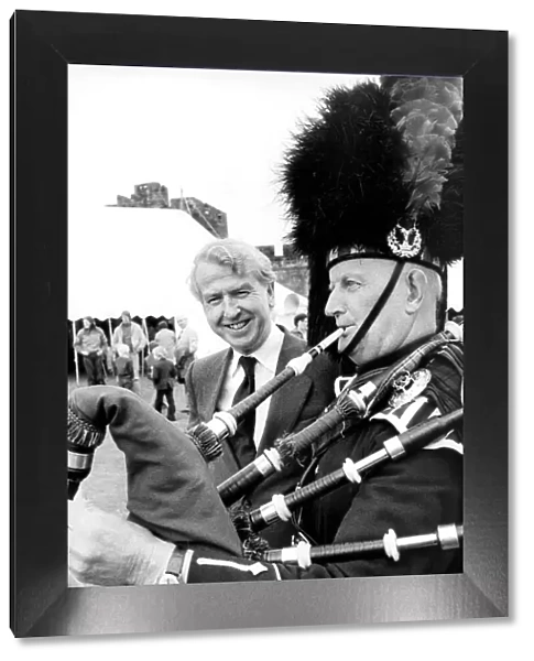 Alnwick Piper Jimmy Jones talks with Mr. Peter Walker after piping him in to open a