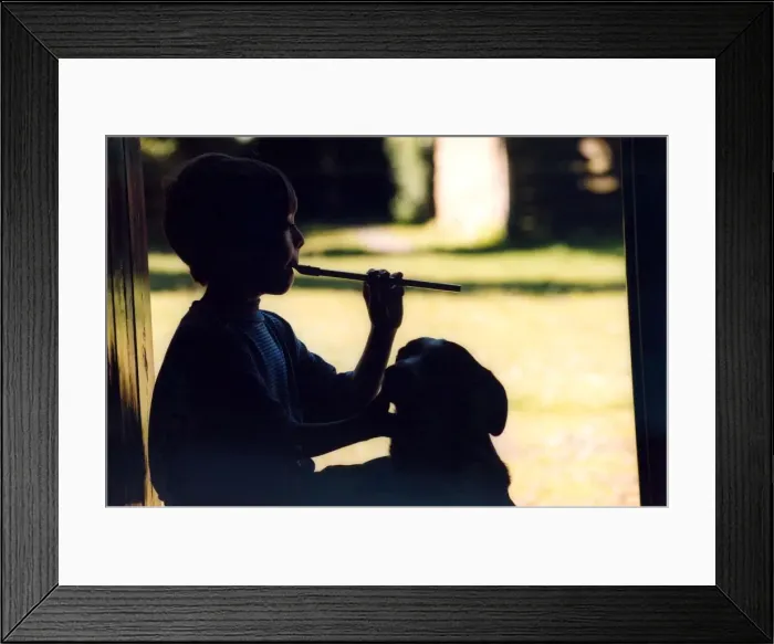 Framed Print : Oliver Jackson, 11, from Hexham plays the penny whistle in June 1998 Framed Print : Oliver Jackson, 11, from Hexham plays the penny whistle in June 1998