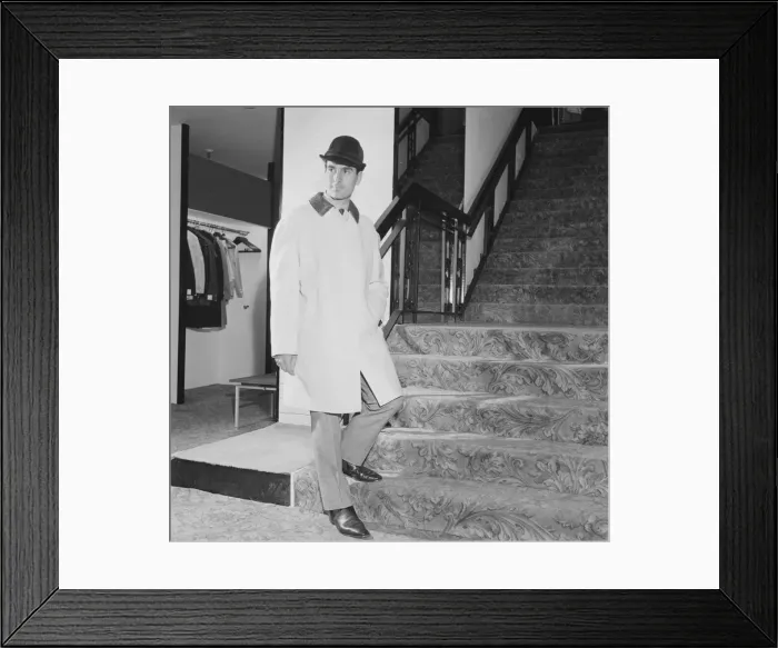 Framed Print : Reveille Mens Fashions of the Future shoot. Man wearing raincoat and hat on stairs