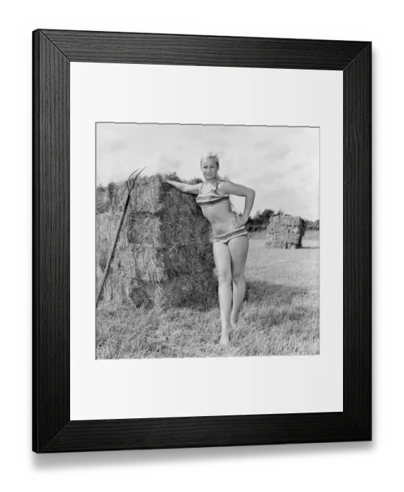 Framed Print : Woman modelling beachwear in a field during harvest Framed Print : Woman modelling beachwear in a field during harvest