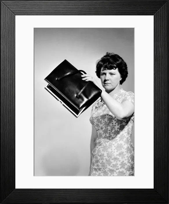 Framed Print : Revielle Model Feature The Contents of a Handbag Circa 1964 Framed Print : Revielle Model Feature The Contents of a Handbag Circa 1964