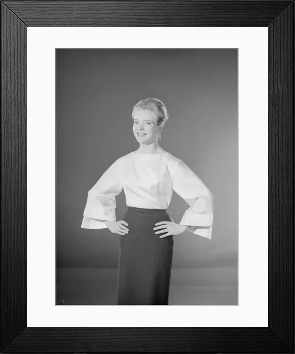 Framed Print : Model Valerie Hollman wearing white blouse and dark skirt