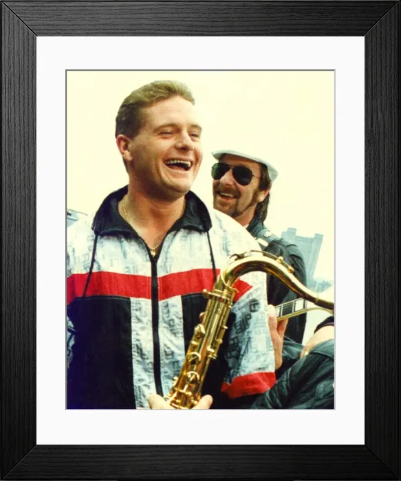 Framed Print : Paul Gascoigne (Gazza) promoting his version of Fog on The Tyne watched by Alan Hull of Framed Print : Paul Gascoigne (Gazza) promoting his version of Fog on The Tyne watched by Alan Hull of