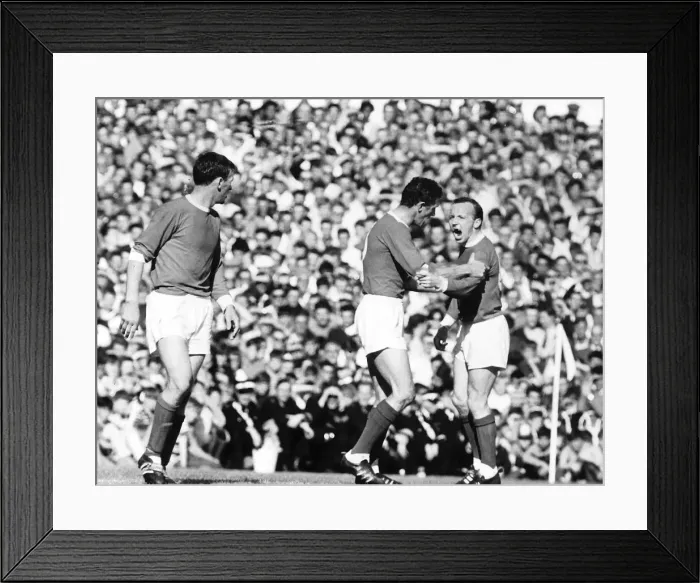 Framed Print : Nobby Stiles is restrained by teamate Bill Faulkes 1966 after an incident with Framed Print : Nobby Stiles is restrained by teamate Bill Faulkes 1966 after an incident with