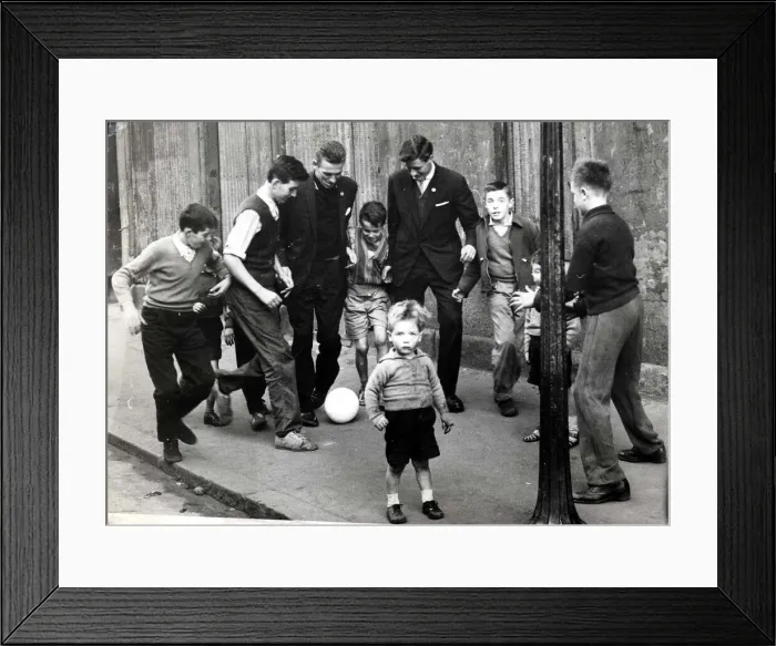Framed Print : Pat Crerand with kids in the street 1960 pat Crerand on left football children