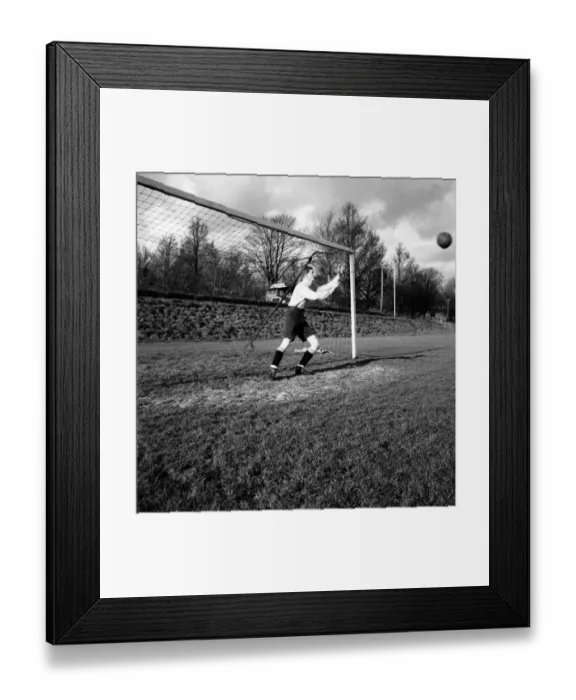 Framed Print : Goalkeeper David Hole dives to try and save the ball going into the goal January