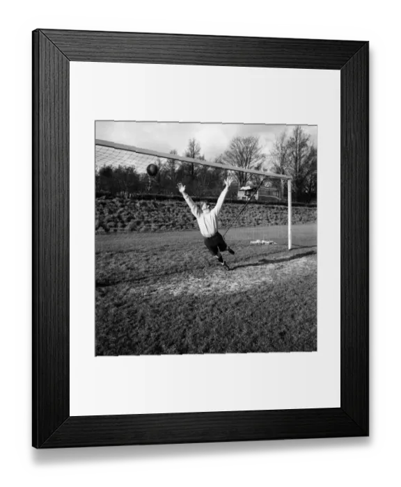 Framed Print : Goalkeeper David Hole dives to try and save the ball going into the goal January