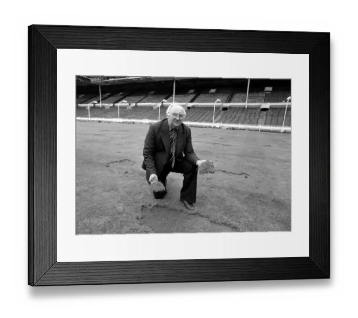 Framed Print : Wembley groundsman Don Gallacher inspects the damage cause by the Scottish fans following