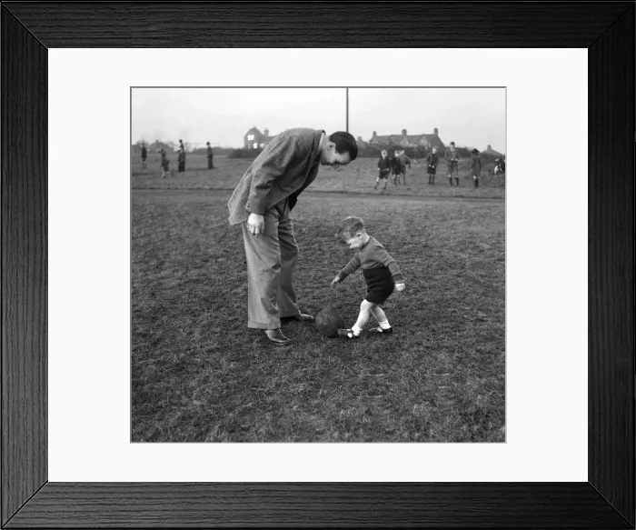Framed Print : Neil Franklin, Stoke city FC and his baby son. January 1947 O6094 Framed Print : Neil Franklin, Stoke city FC and his baby son. January 1947 O6094